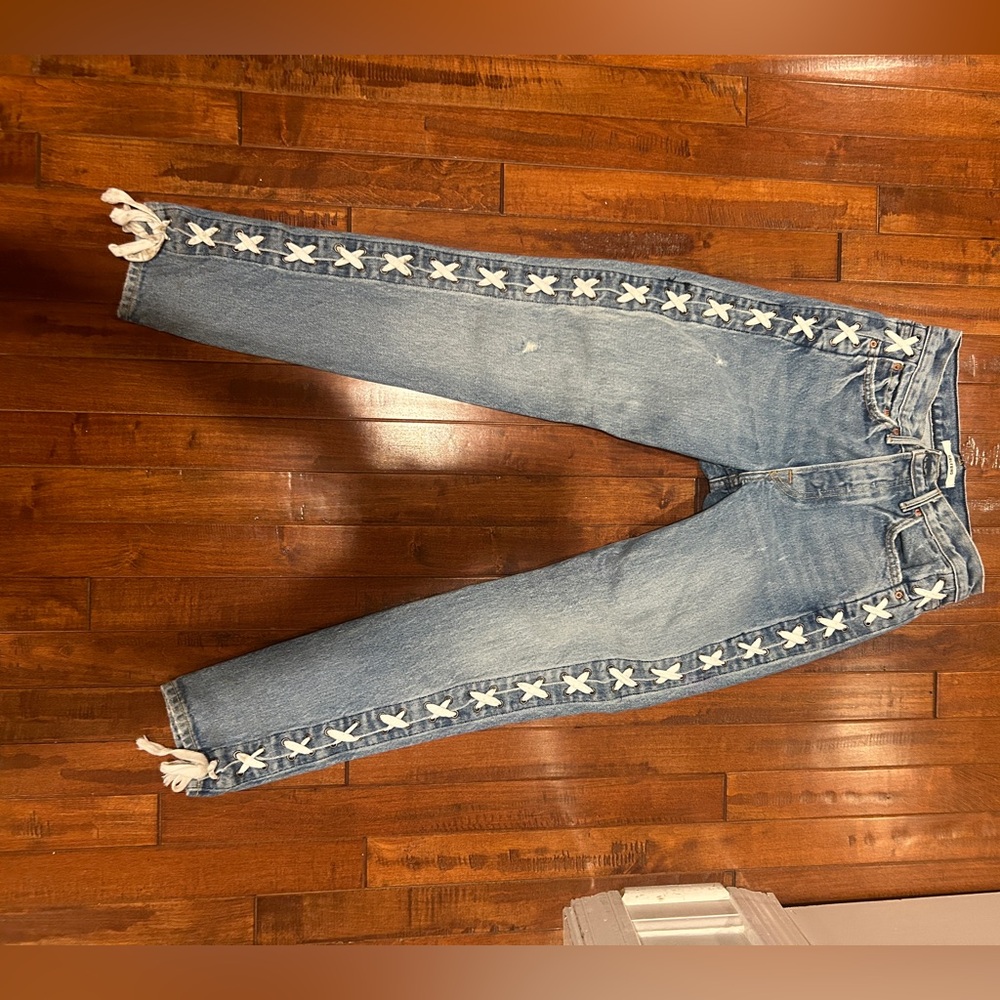 GRLFRND Blue jeans with white tie detailing down the side. Size 25